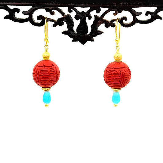 Lackperle Türkis - Mojo Goldene Ohrringe: Goldperle, rote Lackperle, Türkistropfen
am Ornament